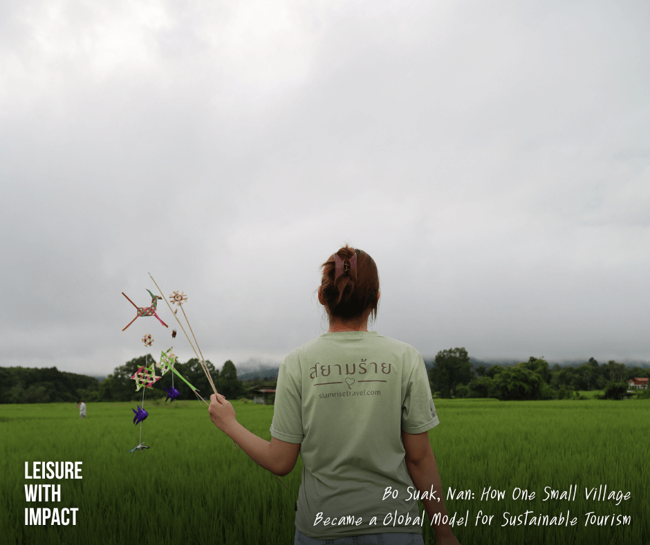 A SiamRise Travel team member holds a traditional Ta Laew in the rice fields of Bo Suak, celebrating authentic community-based tourism and responsible travel in Thailand. A SiamRise Travel team member holds a traditional Ta Laew in the rice fields of Bo Suak, celebrating authentic community-based tourism and responsible travel in Thailand.
