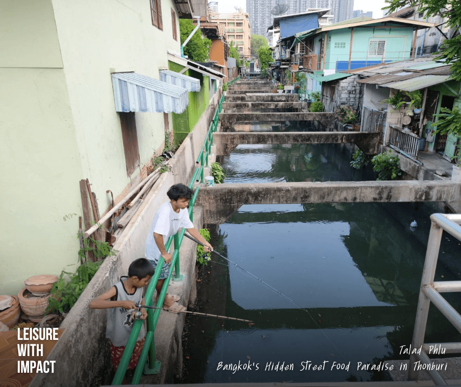 Local boys fishing along the canal in Talad Phlu community Bangkok Local boys fishing along the canal in Talad Phlu community Bangkok
