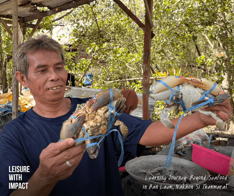A local fisher proudly holding a freshly caught crab in Ban Laem, reflecting the community's commitment to protecting Thailand's coastal heritage. A local fisher proudly holding a freshly caught crab in Ban Laem, reflecting the community's commitment to protecting Thailand's coastal heritage.
