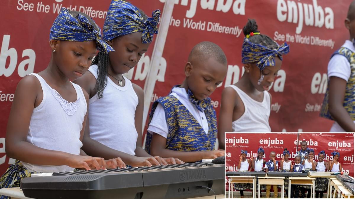 Learners playing the piano. Inset: The learners posing for a picture after the performance. Learners playing the piano. Inset: The learners posing for a picture after the performance.