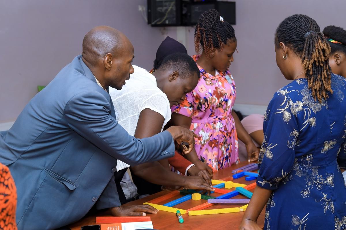Conference participants interacting with the play-based model of learning. Conference participants interacting with the play-based model of learning.