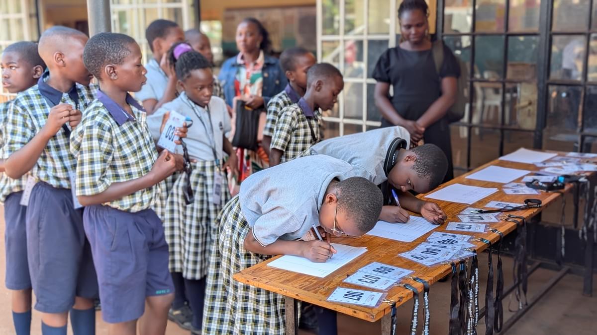 Spellers registering during the Jinja district spelling bee. Spellers registering during the Jinja district spelling bee.