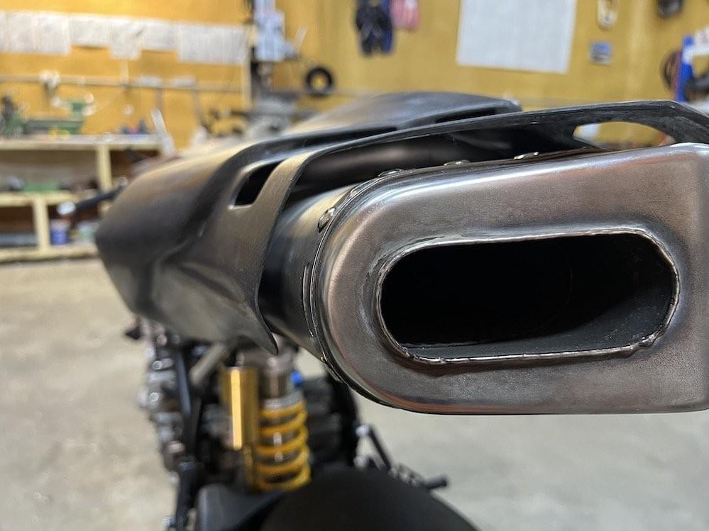 Subframe tube wedged between muffler and tail Subframe tube wedged between muffler and tail
