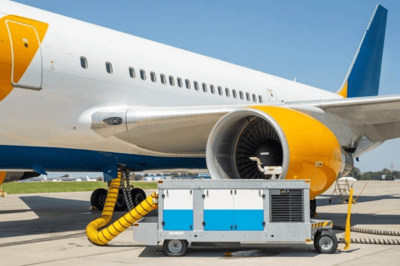 aircraft ground power unit powering airplane on tarmac aircraft ground power unit powering airplane on tarmac