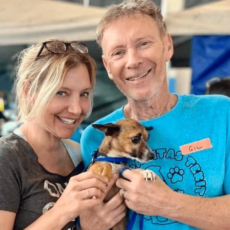 Heather and Gil posing with a chihuahua at a spay and neuter clinic. Heather and Gil posing with a chihuahua at a spay and neuter clinic.