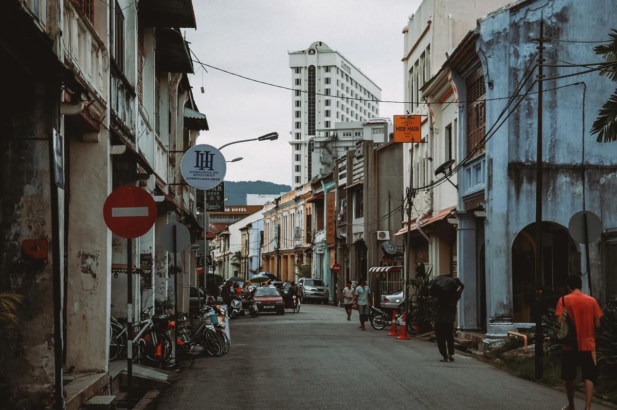 Populated George Town street with historic buildings in Malaysia Populated George Town street with historic buildings in Malaysia
