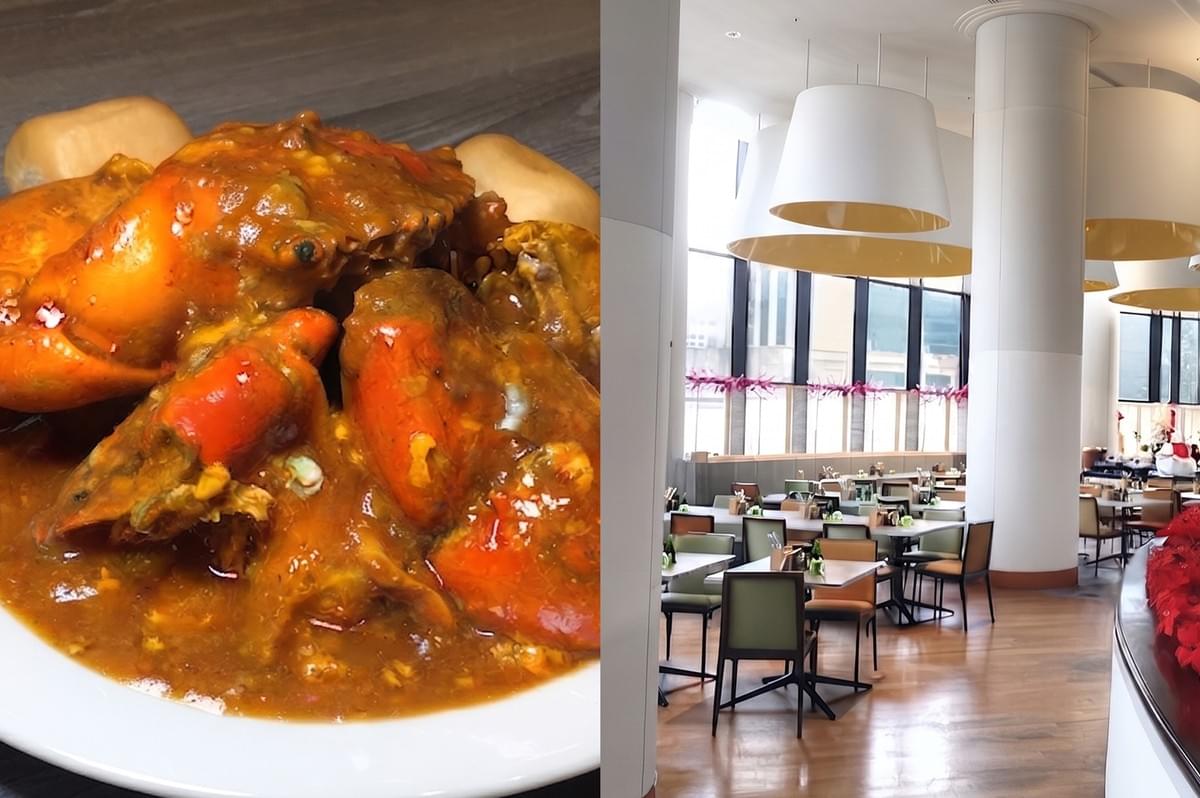 Close-up of a plate of Singaporean-style chili crab with mantou buns at Atrium Restaurant, featuring a modern dining room setting. Close-up of a plate of Singaporean-style chili crab with mantou buns at Atrium Restaurant, featuring a modern dining room setting.