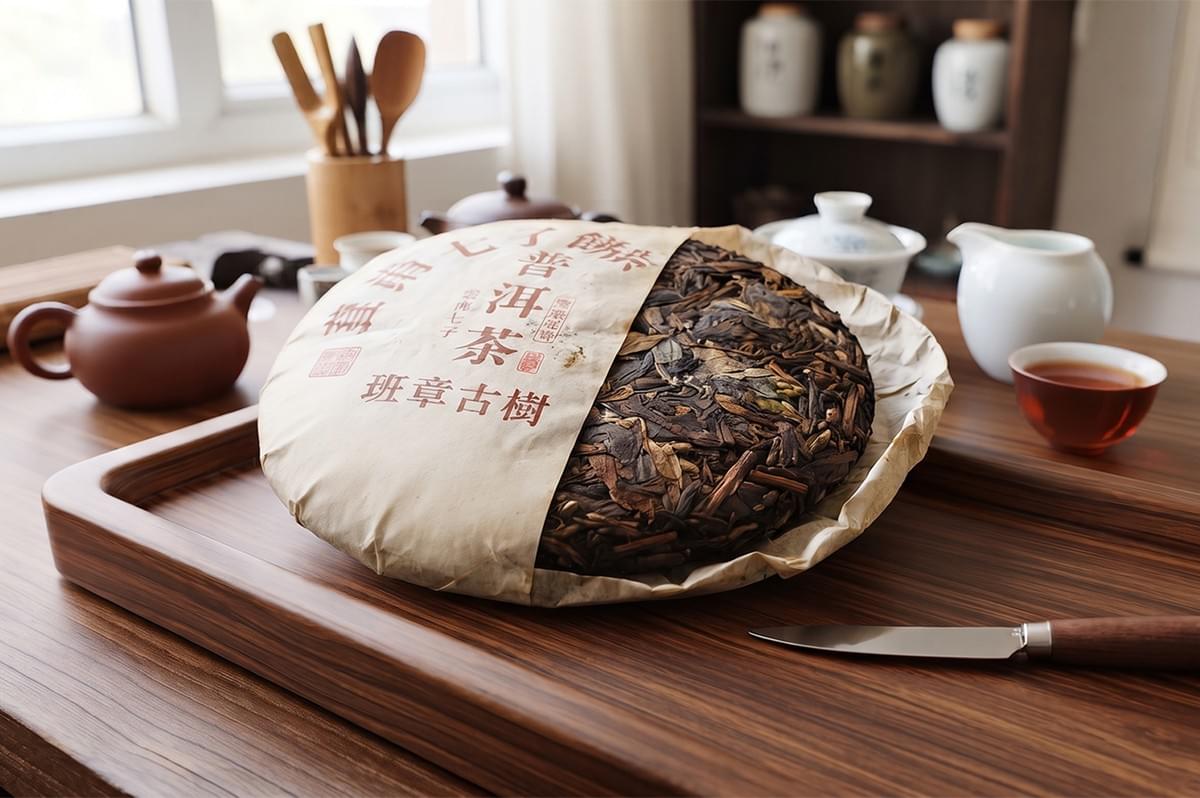 A wrapped cake of aged Pu-erh tea displayed on a wooden tea tray with a tea knife. A wrapped cake of aged Pu-erh tea displayed on a wooden tea tray with a tea knife.