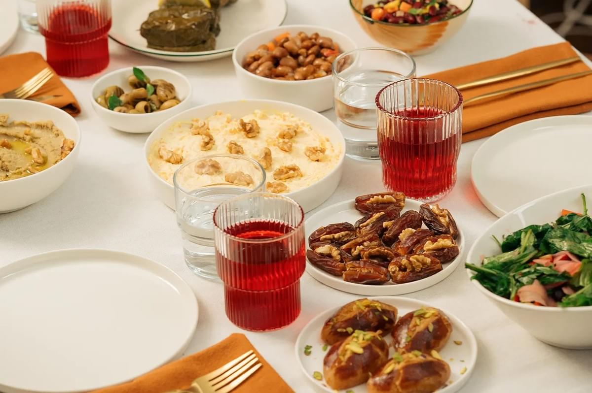 Halal and organic food spread on a dining table for a shared meal. Halal and organic food spread on a dining table for a shared meal.