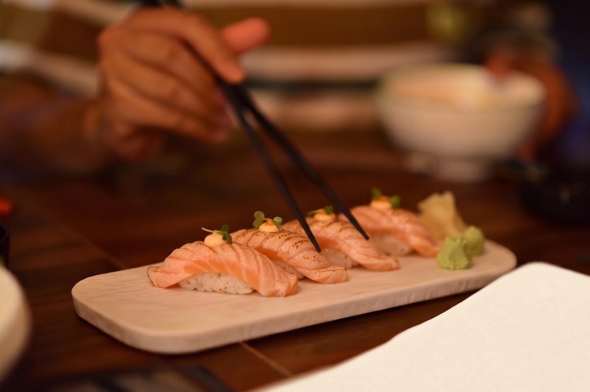 A plate of fresh salmon sushi at Junshin Express in Bedok Mall, Singapore. A plate of fresh salmon sushi at Junshin Express in Bedok Mall, Singapore.