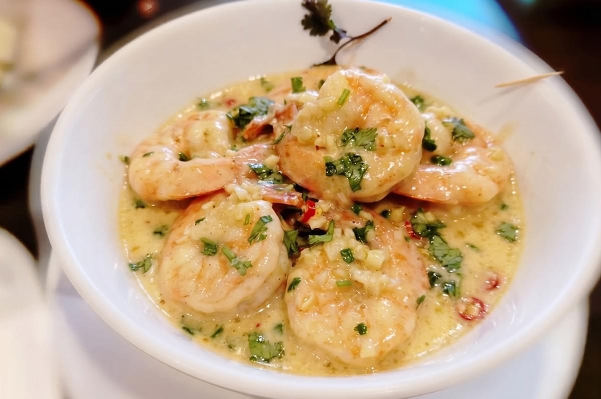 Cream sauce prawns in a white bowl at Segar Restaurant. Cream sauce prawns in a white bowl at Segar Restaurant.