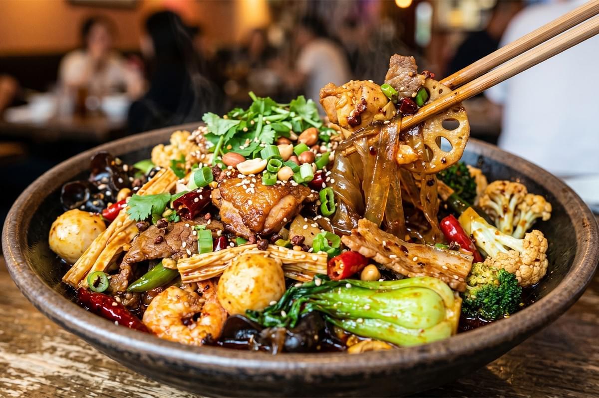 Sichuan mala xiang guo spicy dry pot with noodles, shrimp, chicken, and vegetables. Sichuan mala xiang guo spicy dry pot with noodles, shrimp, chicken, and vegetables.
