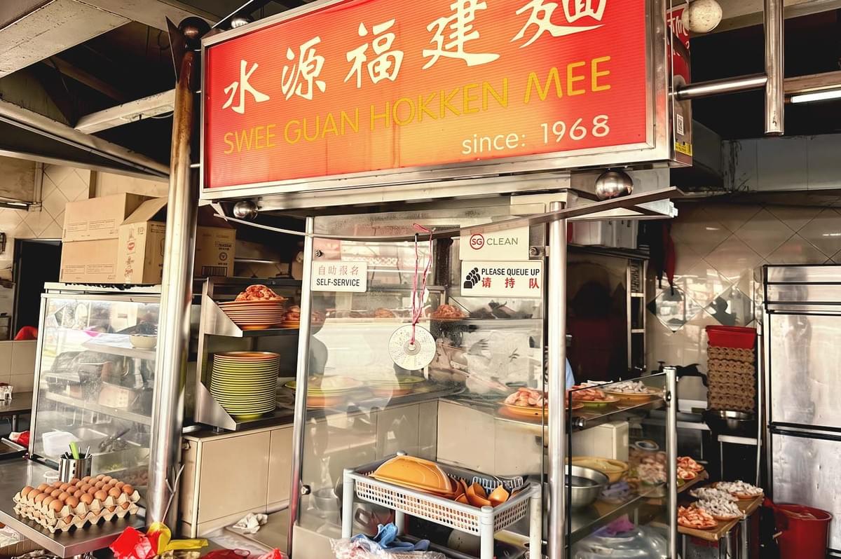 Simple food stall with installed red signage of Swee Guan Hokkien Mee Simple food stall with installed red signage of Swee Guan Hokkien Mee