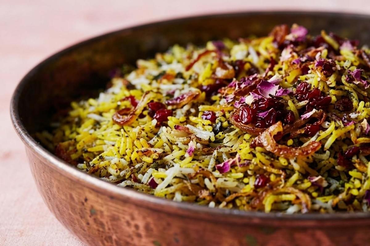 Persian Polow rice mixed with herbs, barberries, and rose petals Persian Polow rice mixed with herbs, barberries, and rose petals