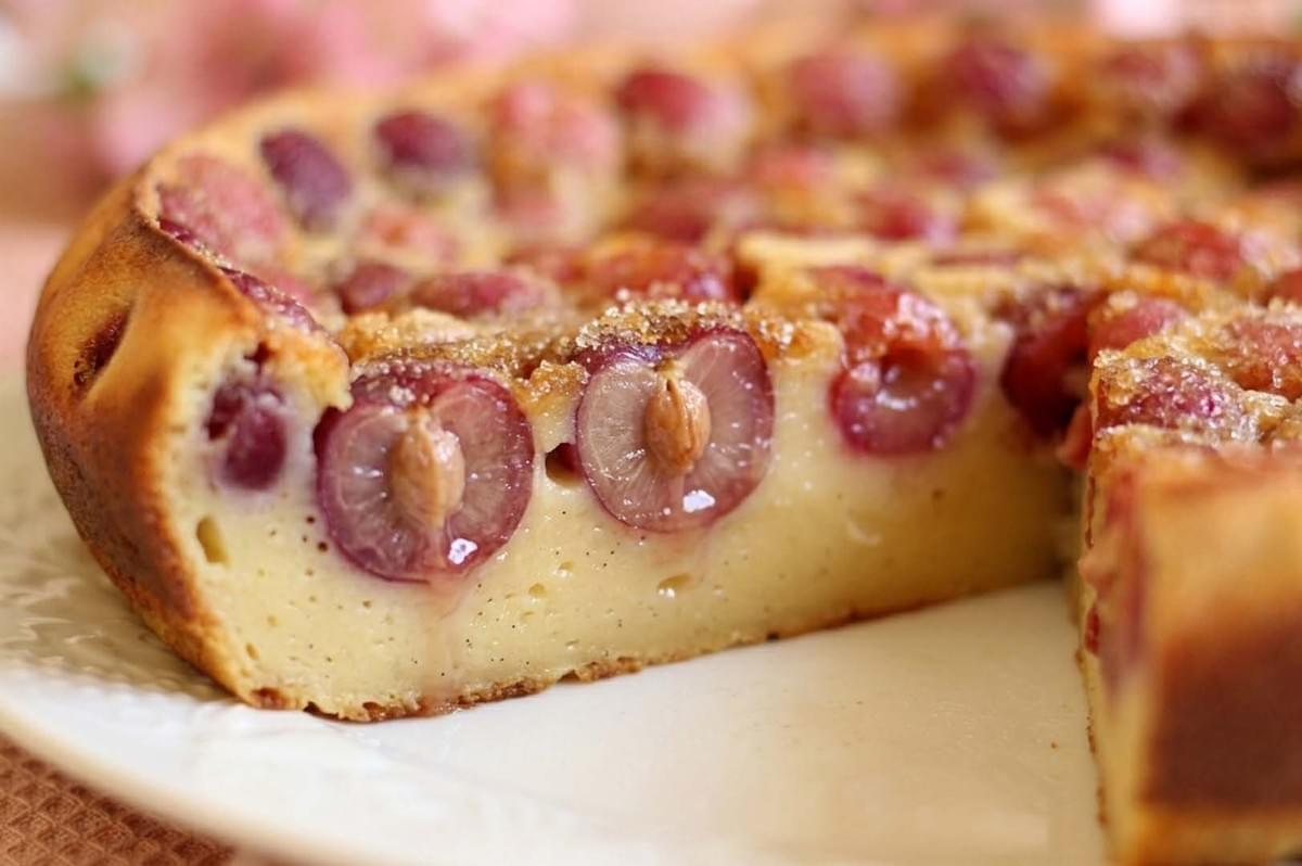 Sliced clafoutis cake with baked cherries Sliced clafoutis cake with baked cherries