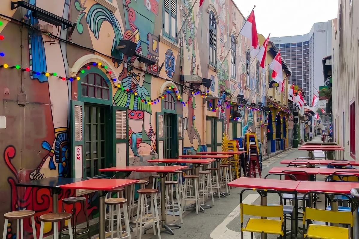 Colorful Aztec-style street art and outdoor seating at Haji Lane, Singapore. Colorful Aztec-style street art and outdoor seating at Haji Lane, Singapore.