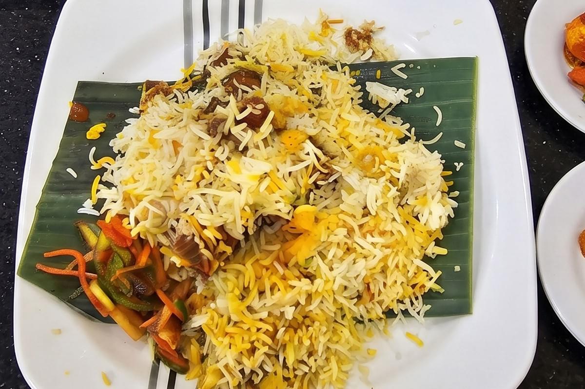 Saffrons Restaurant Gold Class Briyani served on banana leaf. Saffrons Restaurant Gold Class Briyani served on banana leaf.
