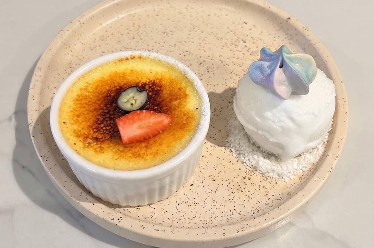 Berry panna cotta and gourmet dessert served on an elegant speckled plate. Berry panna cotta and gourmet dessert served on an elegant speckled plate.