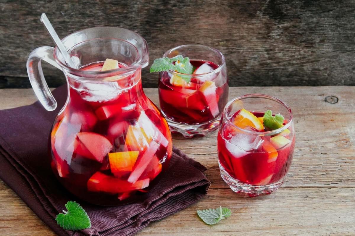 Sangria — Homemade red fruit punch with apples, oranges, lemon, and mint. Sangria — Homemade red fruit punch with apples, oranges, lemon, and mint.
