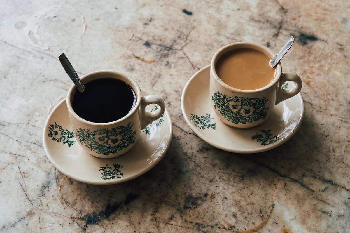 A close-up view of fresh green artichokes arranged in a basket, showing tightly layered leaves and natural texture. A close-up view of fresh green artichokes arranged in a basket, showing tightly layered leaves and natural texture.