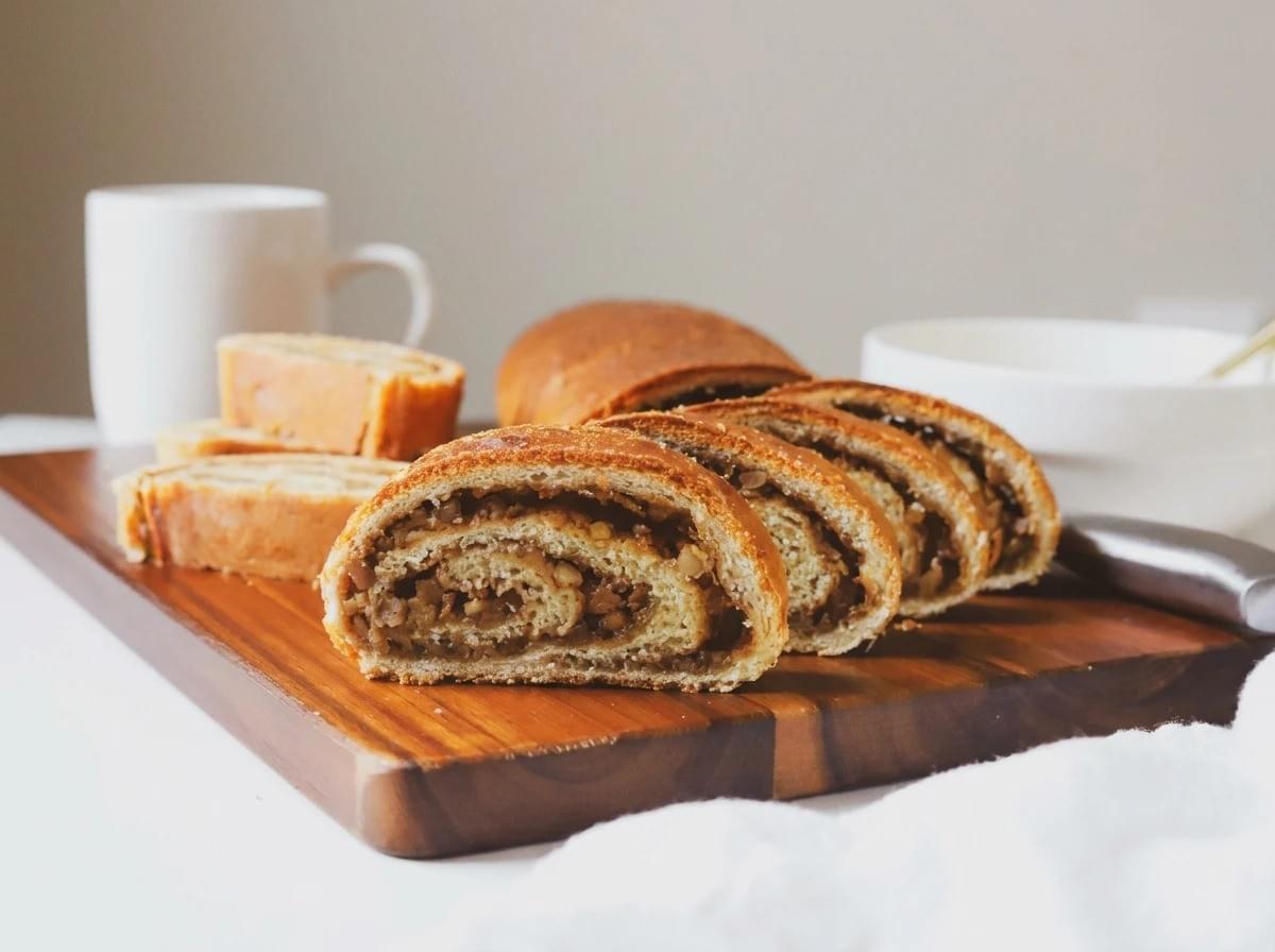 Arranged elegantly on a warm wooden board against a clean neutral background, these perfectly swirled slices offer an effortlessly chic, serene afternoon-tea vibe. Arranged elegantly on a warm wooden board against a clean neutral background, these perfectly swirled slices offer an effortlessly chic, serene afternoon-tea vibe.