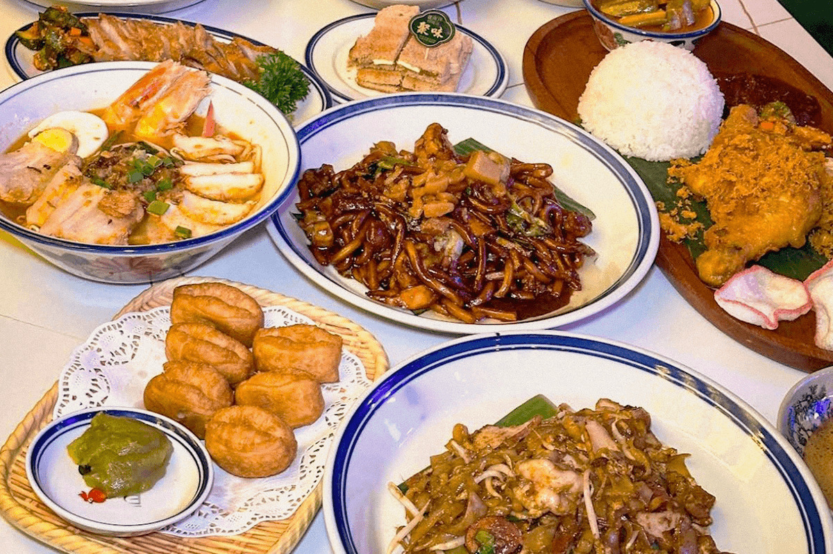 A spread of Asian dishes including noodles, rice, seafood, fried chicken, dumplings, and pastries. A spread of Asian dishes including noodles, rice, seafood, fried chicken, dumplings, and pastries.