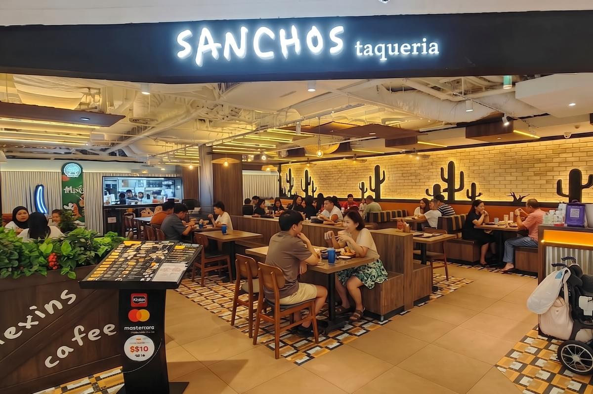 A table full of authentic Mexican dishes including tacos, nachos, quesadillas, and salsa. A table full of authentic Mexican dishes including tacos, nachos, quesadillas, and salsa.