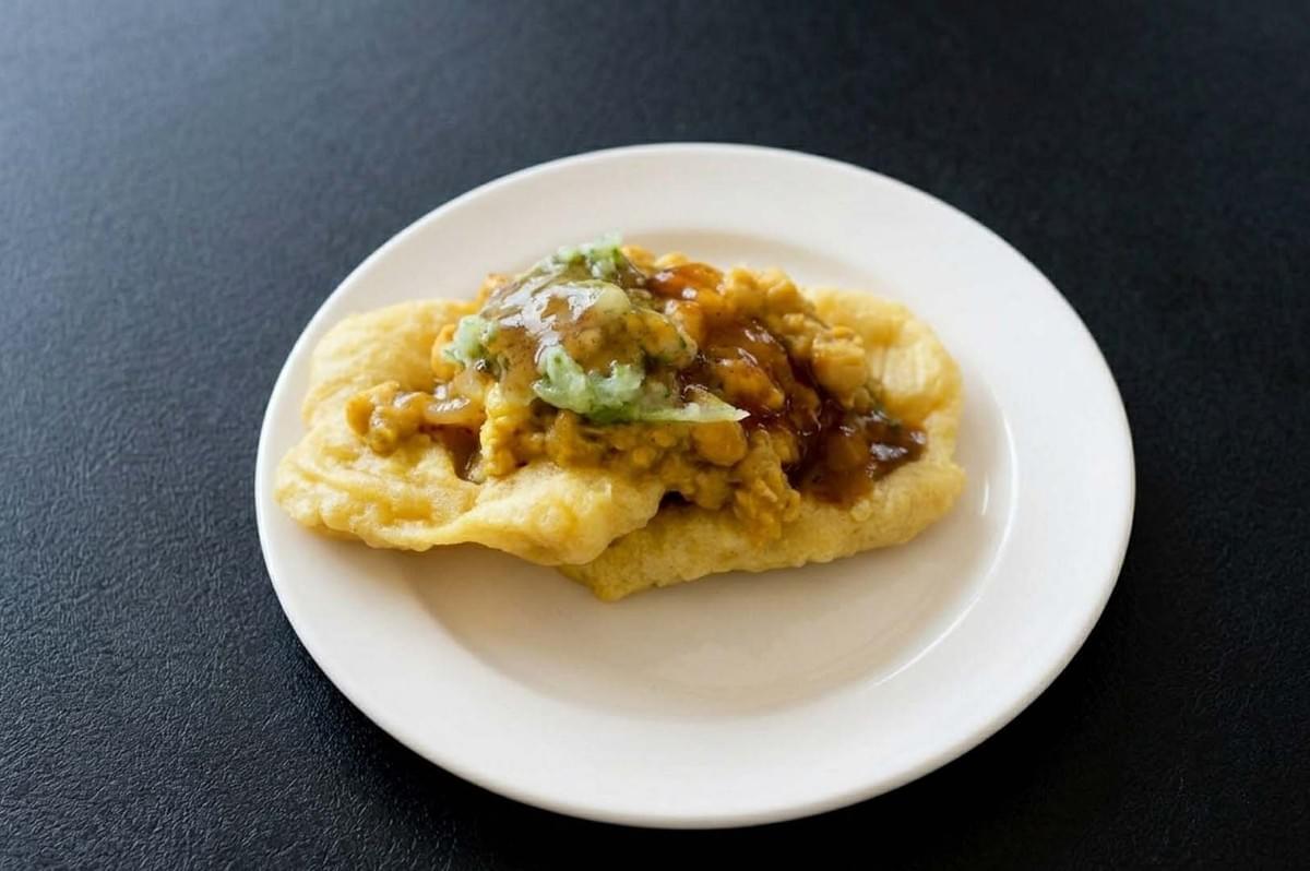 Trinidadian doubles with curried chickpeas on fried bara bread Trinidadian doubles with curried chickpeas on fried bara bread