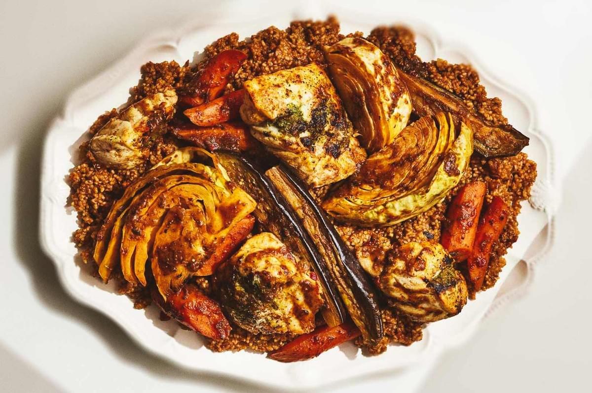 Spiced roasted vegetables served on seasoned couscous. Spiced roasted vegetables served on seasoned couscous.