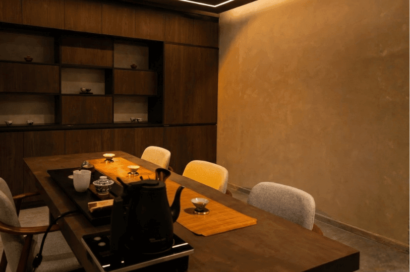 A delicate piece of seasonal uni nigiri served on a rectangular black ceramic plate resting on a light wooden sushi bar at Sushi Masa by Ki-setsu. A delicate piece of seasonal uni nigiri served on a rectangular black ceramic plate resting on a light wooden sushi bar at Sushi Masa by Ki-setsu.