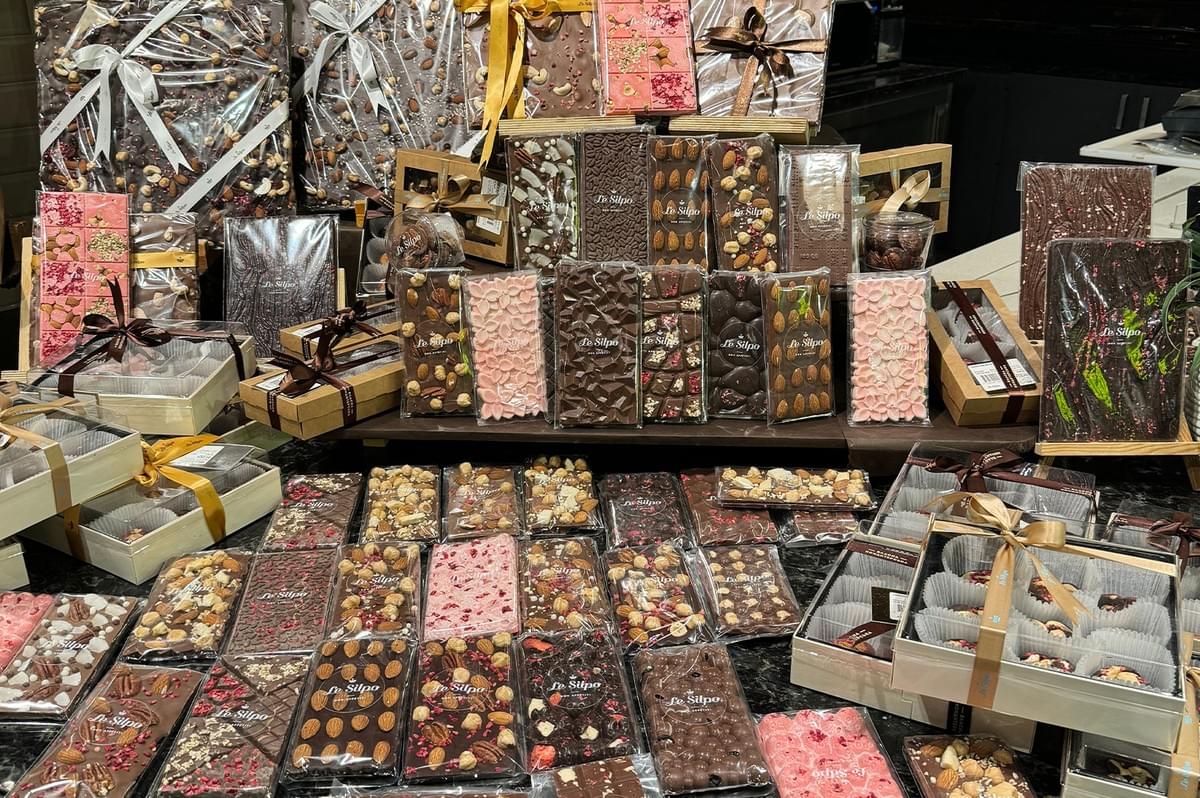 Assortment of halal certified chocolate bars displayed on a table. Assortment of halal certified chocolate bars displayed on a table.