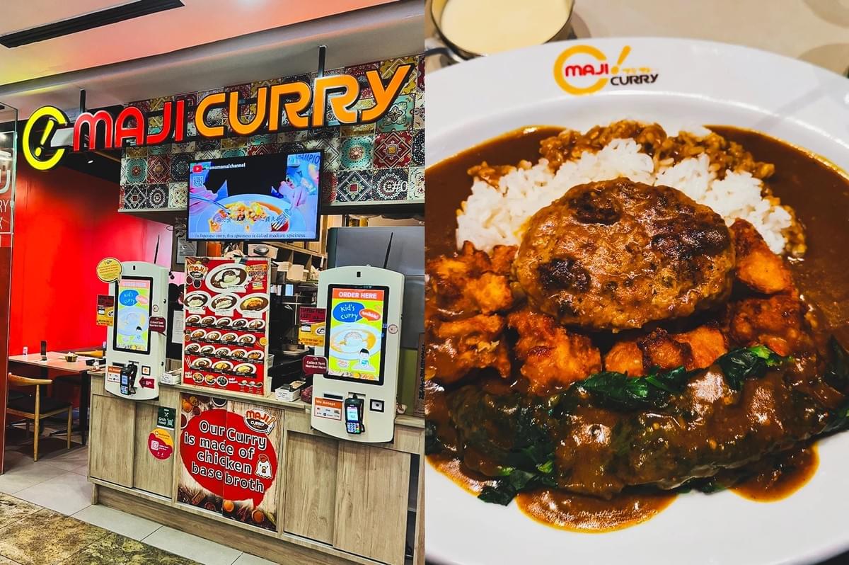 Left: An eye-level, medium-wide shot of a Maji Curry restaurant counter, displaying two electronic self-ordering kiosks with bright touchscreens, an overhead digital display monitor, a red accent wall, and a rustic wooden counter face with a circular sign stating 'Our curry is made of chicken base broth'. Right: A top-down, close-up shot of a Maji Curry dish served in a wide white bowl, featuring a large, browned hamburger meat patty placed atop white rice, surrounded by pieces of fried chicken, sautéed green vegetables, and rich, glossy brown curry sauce. Left: An eye-level, medium-wide shot of a Maji Curry restaurant counter, displaying two electronic self-ordering kiosks with bright touchscreens, an overhead digital display monitor, a red accent wall, and a rustic wooden counter face with a circular sign stating 'Our curry is made of chicken base broth'. Right: A top-down, close-up shot of a Maji Curry dish served in a wide white bowl, featuring a large, browned hamburger meat patty placed atop white rice, surrounded by pieces of fried chicken, sautéed green vegetables, and rich, glossy brown curry sauce.