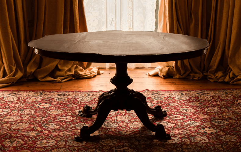 An old round wooden table ready to be painted. An old round wooden table ready to be painted.