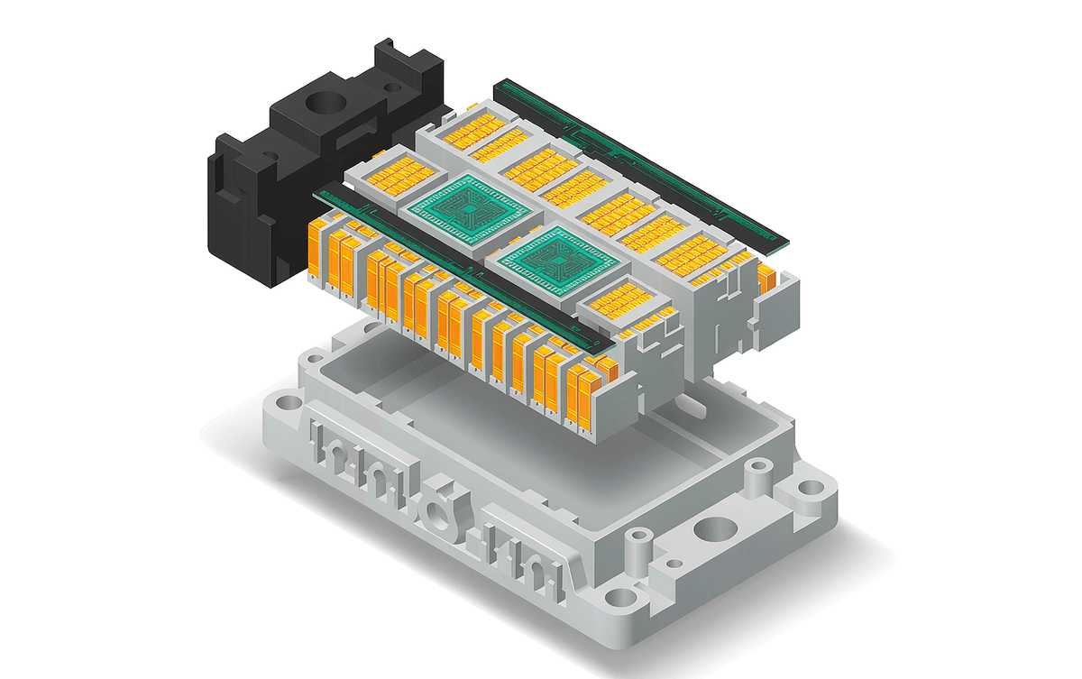 IPM module with lid removed showing SiC and silicon chips in layered stack