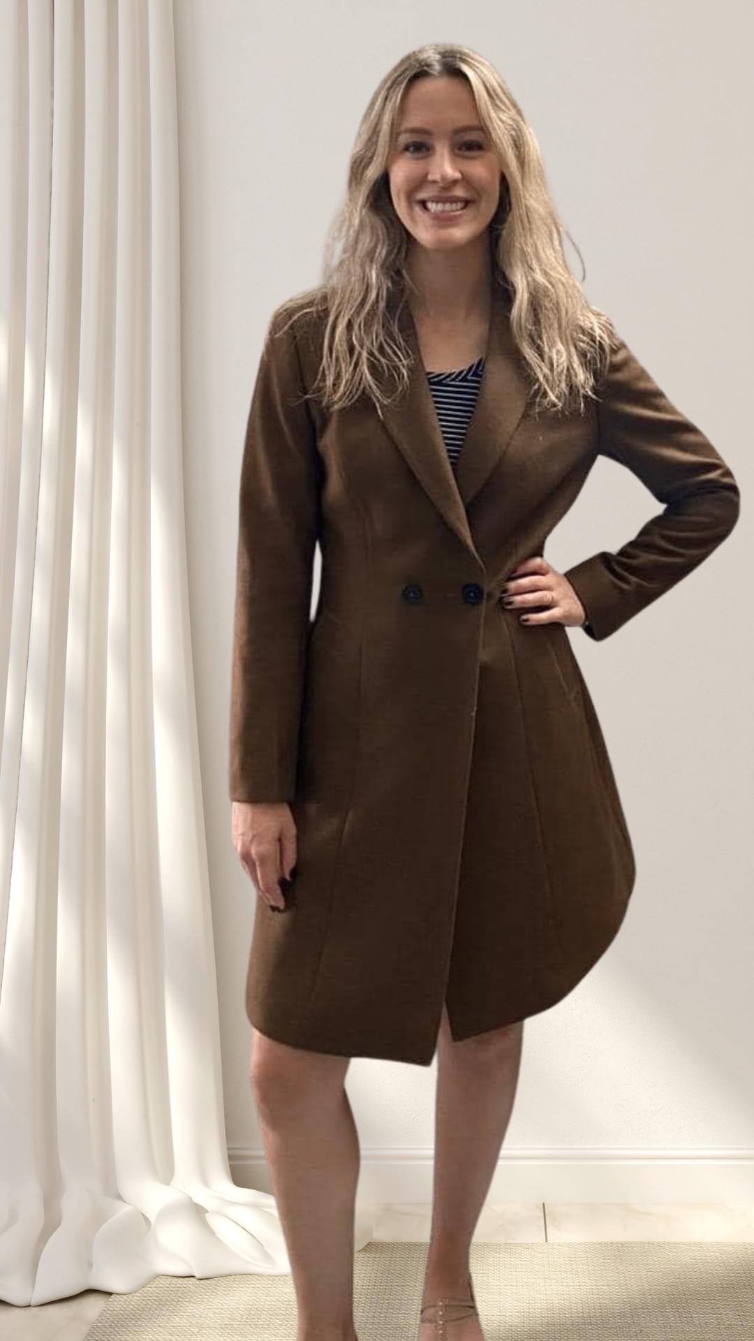 New visitor styled for exploration — in a perfectly fitted coat-dress, with long blonde hair and a big smile as the only accessories needed. New visitor styled for exploration — in a perfectly fitted coat-dress, with long blonde hair and a big smile as the only accessories needed.