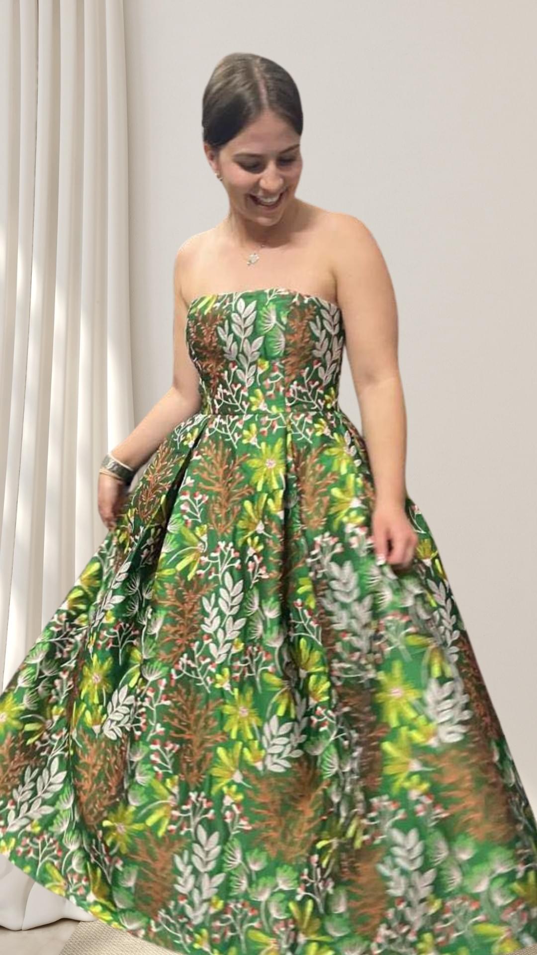 As this charming young lady twirls in her ballgown, the vibrant brocade fabric of greens and mocha shades make a stunning impression. As this charming young lady twirls in her ballgown, the vibrant brocade fabric of greens and mocha shades make a stunning impression.