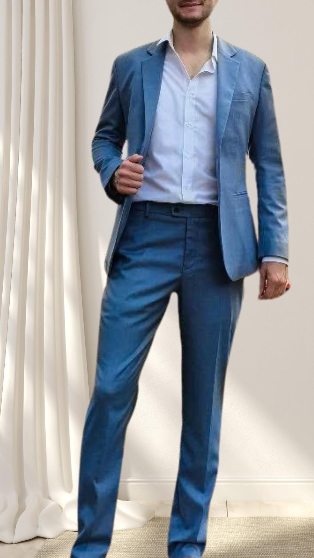 Young professional in a blue tailored suit — confidence and precision shown in his stance and fit. Young professional in a blue tailored suit — confidence and precision shown in his stance and fit.
