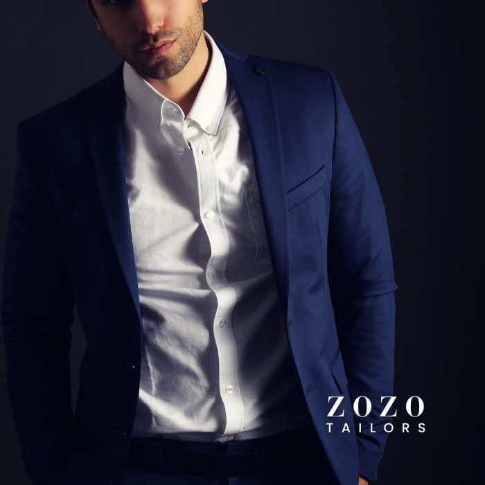 Professional man in custom-tailored jacket and crisp white shirt—demonstrating refined fit and style. Professional man in custom-tailored jacket and crisp white shirt—demonstrating refined fit and style.