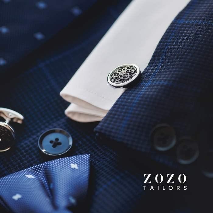 Close-up of cotton shirt and silk tie — showcasing ZoZo’s attention to finishing details and fabric pairing. Close-up of cotton shirt and silk tie — showcasing ZoZo’s attention to finishing details and fabric pairing.