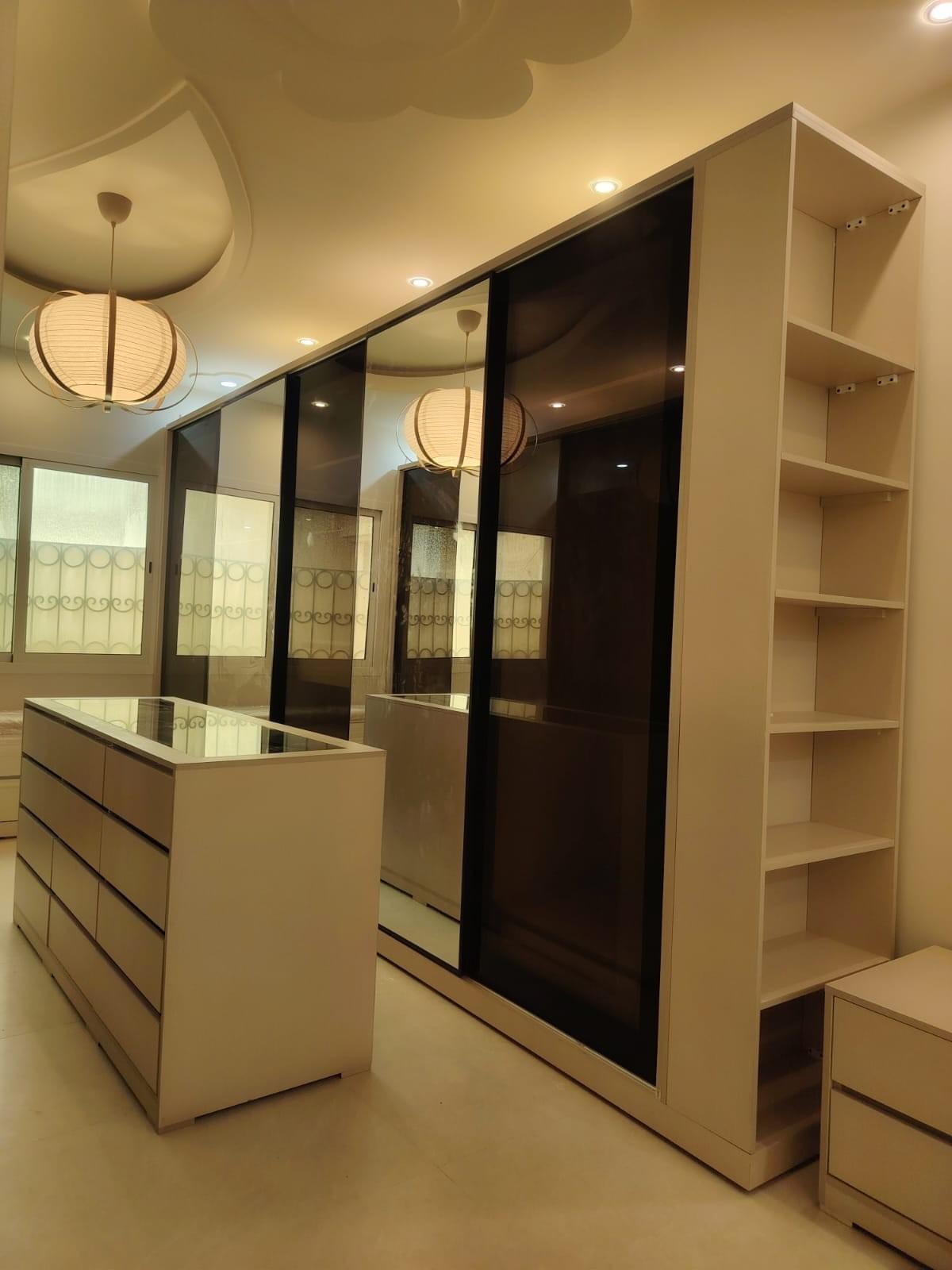 We offer custom cabinet designs that match your home space and taste, with multiple options of hydraulic doors, arrow, and wooden and glass doors to ensure excellence and comfort in every detail. Custom designs Features list Kingdom of cabinet delivery with 15 years of experience in cabinet and wardrobe tailoring. We manufacture all types of wardrobes and cabinets such as corner wardrobes, wall wardrobes, dressing rooms, with hydraulic doors, arrow doors, wooden doors wardrobes, glass doors wardrobes. I want the site to include a detailed explanation of the types of wardrobes and cabinets, dressing rooms, tailoring of cabinets, wardrobes, and dressing rooms in Qatif, Dammam, Khobar, and Dhahran. We offer custom cabinet designs that match your home space and taste, with multiple options of hydraulic doors, arrow, and wooden and glass doors to ensure excellence and comfort in every detail. Custom designs Features list Kingdom of cabinet delivery with 15 years of experience in cabinet and wardrobe tailoring. We manufacture all types of wardrobes and cabinets such as corner wardrobes, wall wardrobes, dressing rooms, with hydraulic doors, arrow doors, wooden doors wardrobes, glass doors wardrobes. I want the site to include a detailed explanation of the types of wardrobes and cabinets, dressing rooms, tailoring of cabinets, wardrobes, and dressing rooms in Qatif, Dammam, Khobar, and Dhahran.
