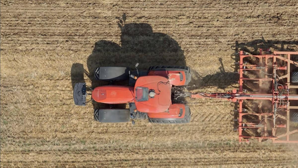 Tractor Rowing Crop on the field Tractor Rowing Crop on the field