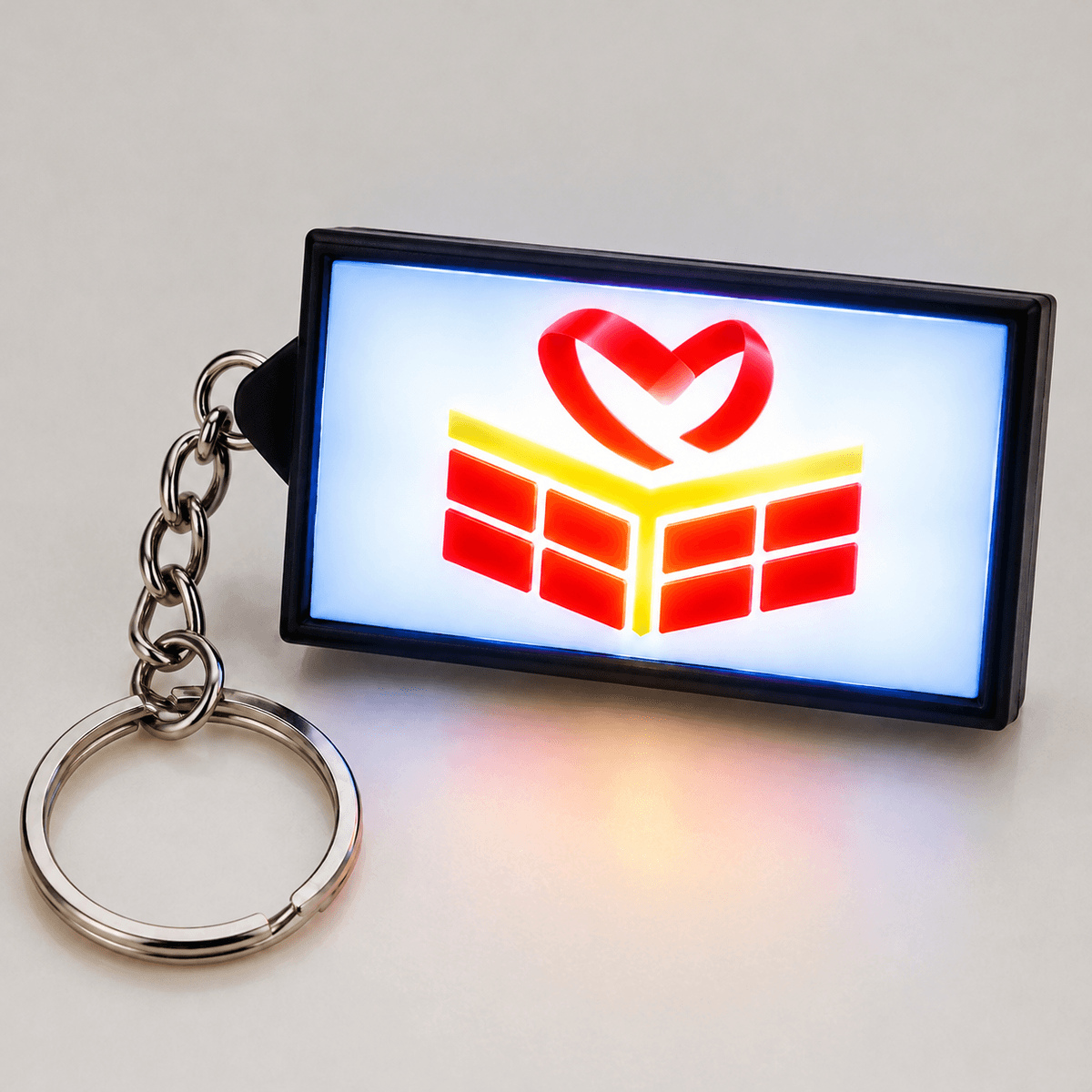 Illuminated LED sign keychain glowing in the dark Illuminated LED sign keychain glowing in the dark