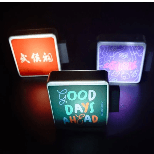 Glowing LED sign fridge magnet illuminated in the dark Glowing LED sign fridge magnet illuminated in the dark