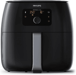 Philips Premium Airfryer XXL on countertop with crispy fries Philips Premium Airfryer XXL on countertop with crispy fries