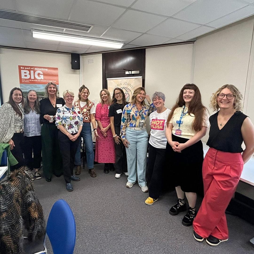 A group of women standing side by side, and facing towards the camera. They are smiling. A group of women standing side by side, and facing towards the camera. They are smiling.
