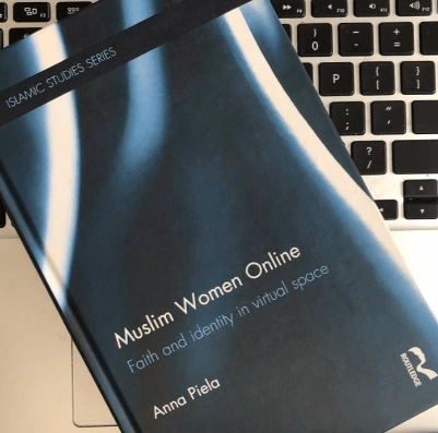 a picture of the Muslim Women online book on a laptop keyboard a picture of the Muslim Women online book on a laptop keyboard