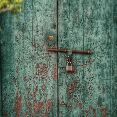 Picture of a green door with a padlock on Picture of a green door with a padlock on