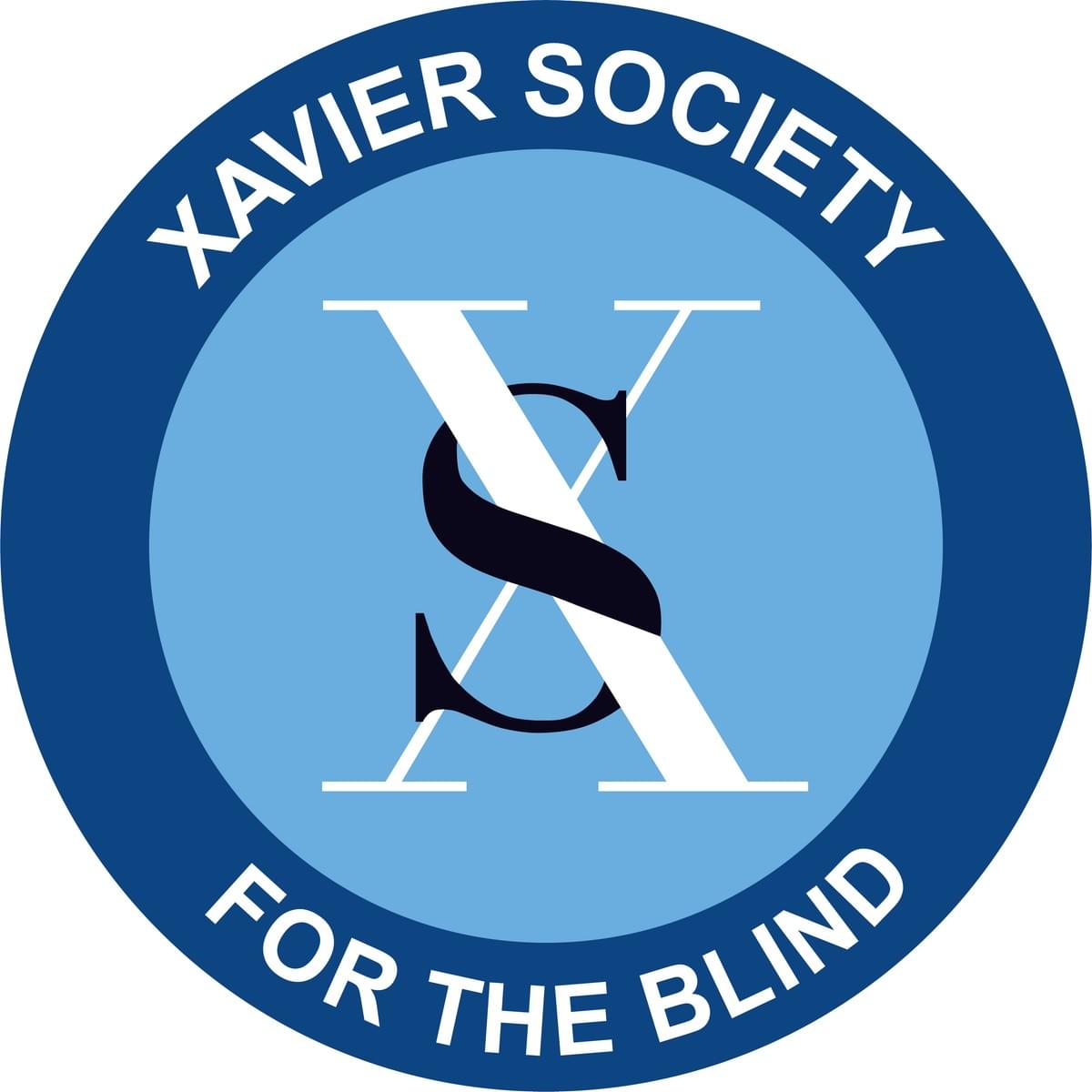 Dark blue ring around a light blue circle with Xavier Society for the Blind in white on the dark blue and white X and black S in the center on the light blue circle Dark blue ring around a light blue circle with Xavier Society for the Blind in white on the dark blue and white X and black S in the center on the light blue circle
