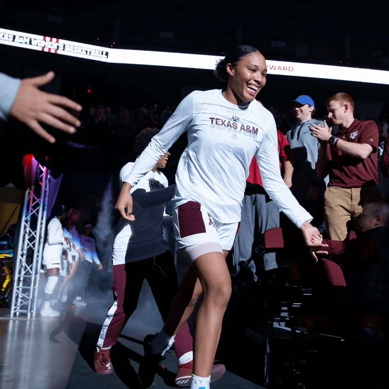 N'Dea runs into arena giving high fives N'Dea runs into arena giving high fives