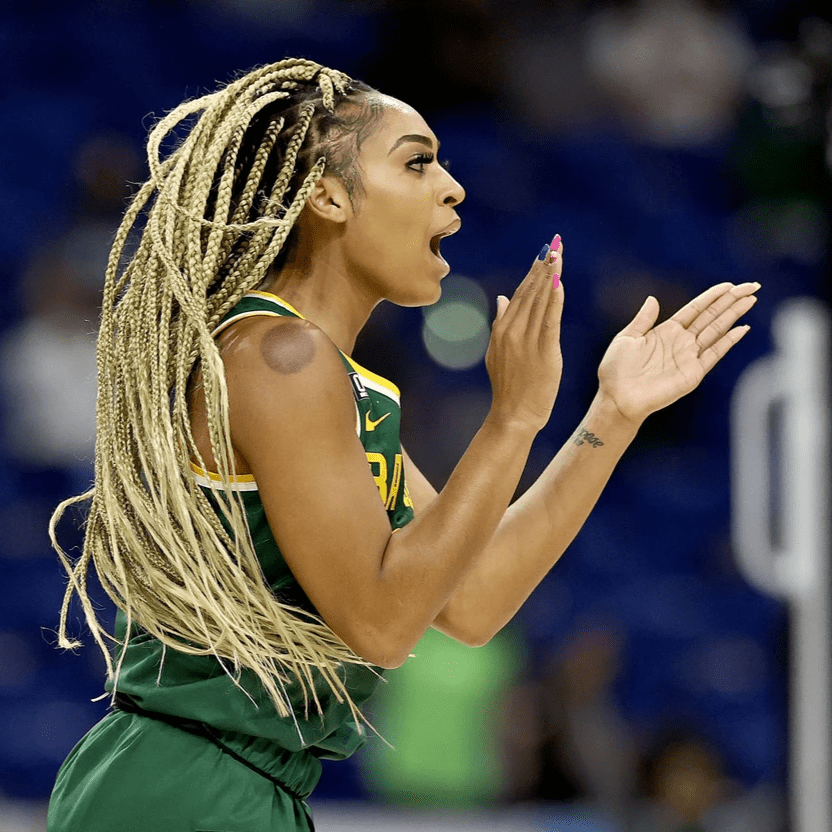 DiJonai claps on the court in green Baylor uniform DiJonai claps on the court in green Baylor uniform